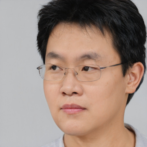 Neutral asian young-adult male with short  black hair and brown eyes