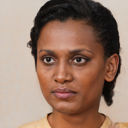 Neutral black young-adult female with short  brown hair and brown eyes