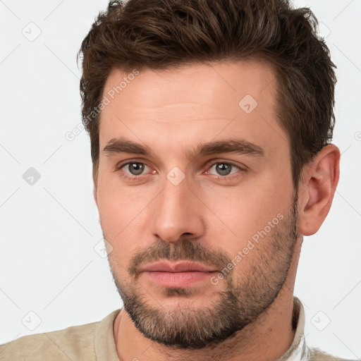 Neutral white young-adult male with short  brown hair and brown eyes