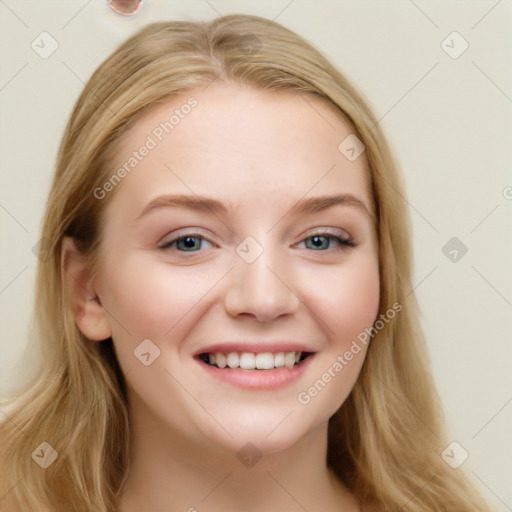 Joyful white young-adult female with long  brown hair and blue eyes