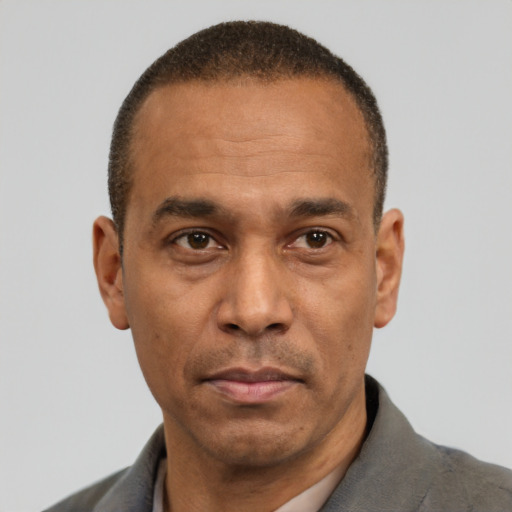 Neutral latino adult male with short  black hair and brown eyes