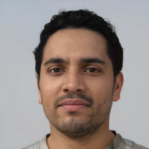 Neutral latino young-adult male with short  black hair and brown eyes