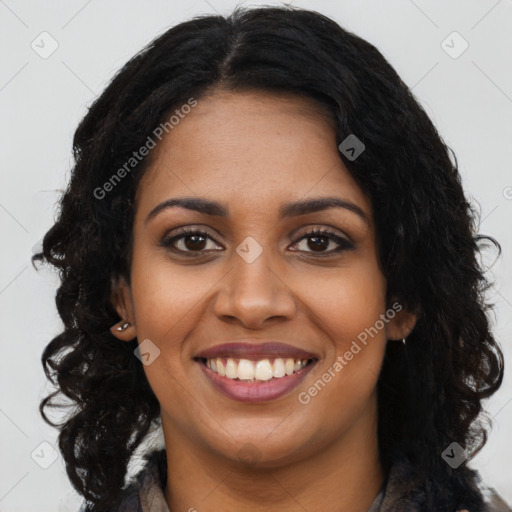 Joyful black young-adult female with long  brown hair and brown eyes