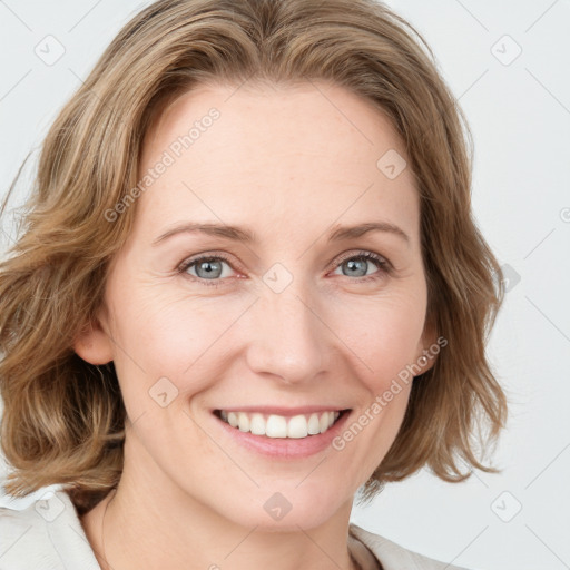 Joyful white young-adult female with medium  brown hair and blue eyes