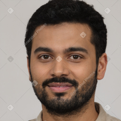 Joyful latino young-adult male with short  black hair and brown eyes