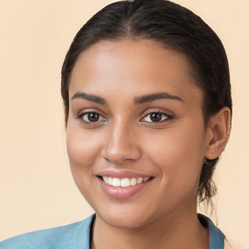 Joyful white young-adult female with medium  brown hair and brown eyes