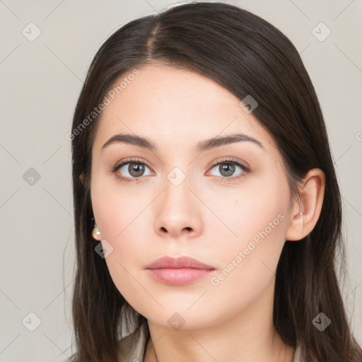 Neutral white young-adult female with long  brown hair and brown eyes