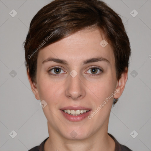 Joyful white young-adult female with short  brown hair and grey eyes