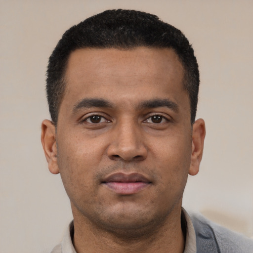 Neutral latino young-adult male with short  black hair and brown eyes