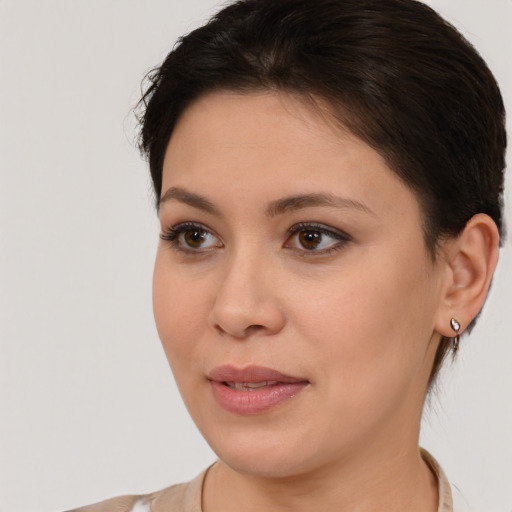 Joyful white young-adult female with short  brown hair and brown eyes