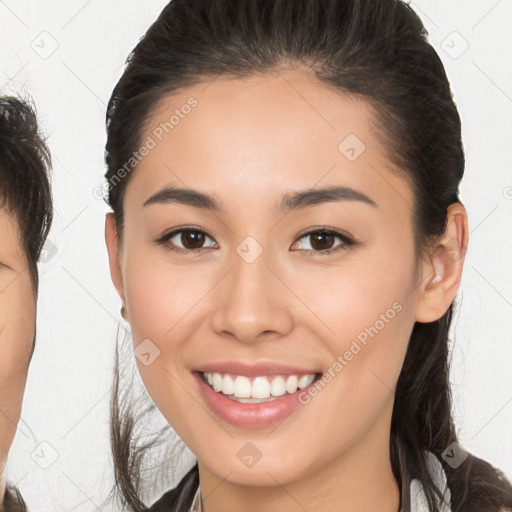 Joyful white young-adult female with medium  brown hair and brown eyes