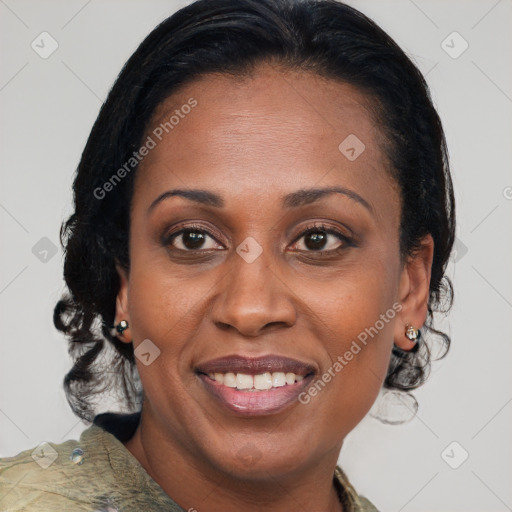 Joyful black adult female with medium  brown hair and brown eyes