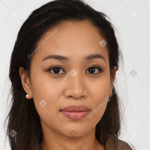 Joyful latino young-adult female with long  brown hair and brown eyes