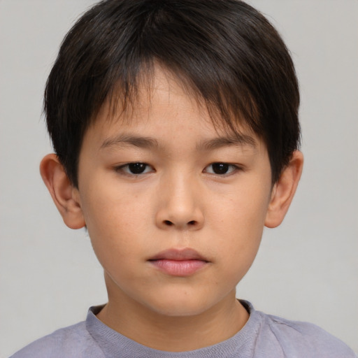 Neutral asian child male with short  brown hair and brown eyes