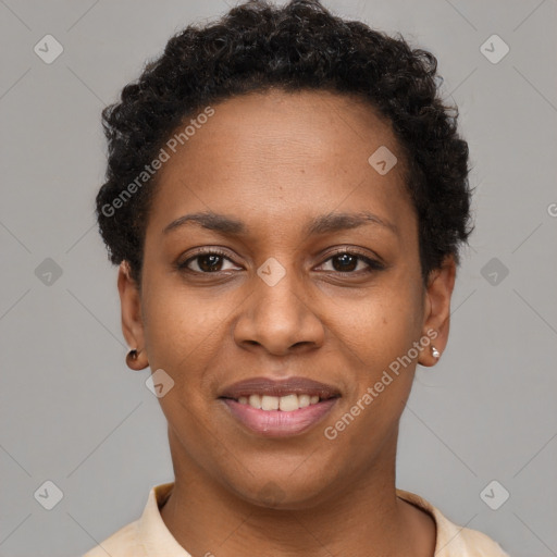 Joyful black young-adult female with short  brown hair and brown eyes