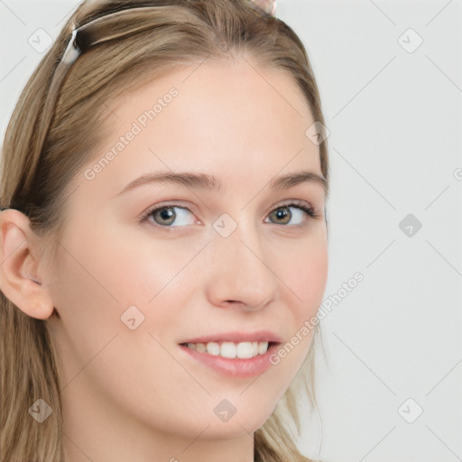 Joyful white young-adult female with long  brown hair and blue eyes