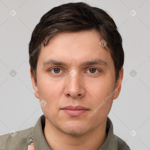 Neutral white young-adult male with short  brown hair and grey eyes