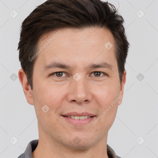 Joyful white adult male with short  brown hair and brown eyes