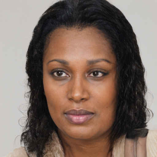 Neutral black young-adult female with long  black hair and brown eyes