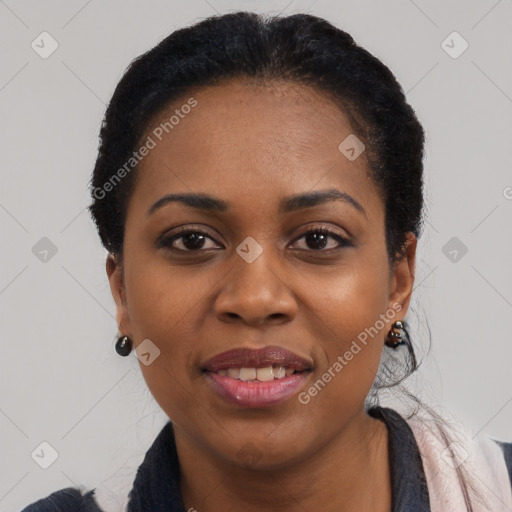 Joyful black young-adult female with long  black hair and brown eyes