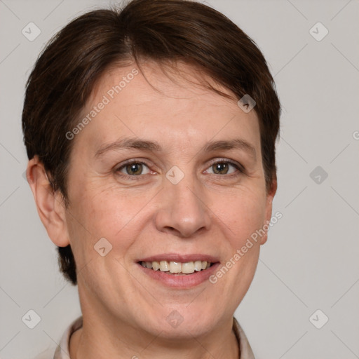 Joyful white adult female with short  brown hair and grey eyes