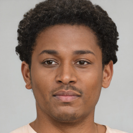 Neutral latino young-adult male with short  brown hair and brown eyes