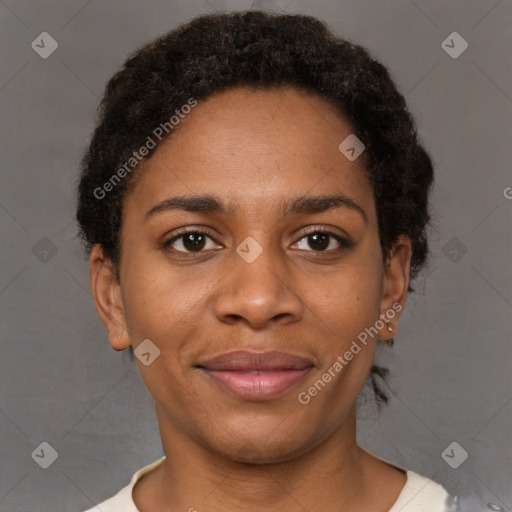 Joyful black young-adult female with short  brown hair and brown eyes