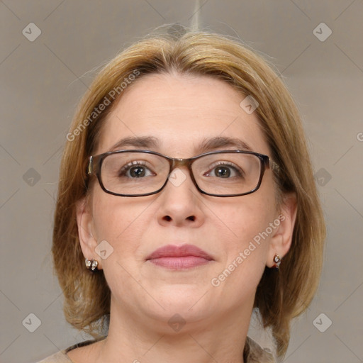 Joyful white adult female with medium  brown hair and blue eyes