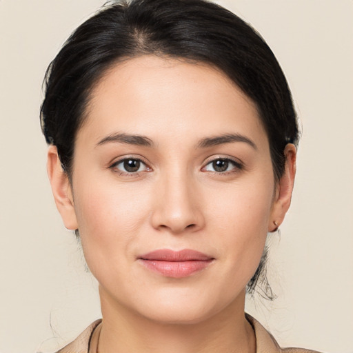 Joyful white young-adult female with medium  brown hair and brown eyes