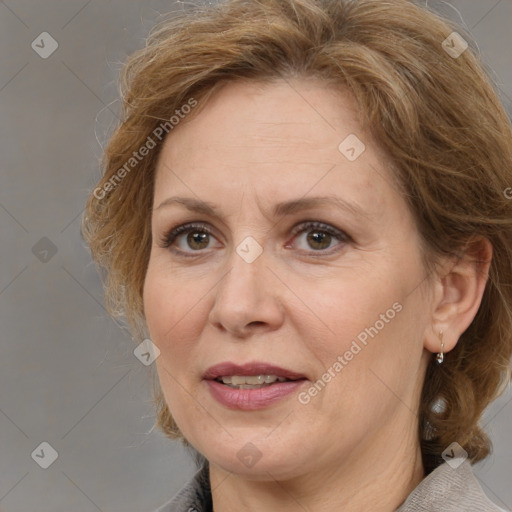 Joyful white adult female with medium  brown hair and brown eyes