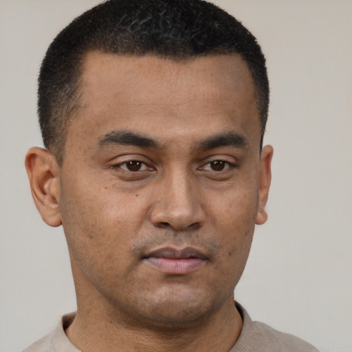 Neutral latino young-adult male with short  brown hair and brown eyes