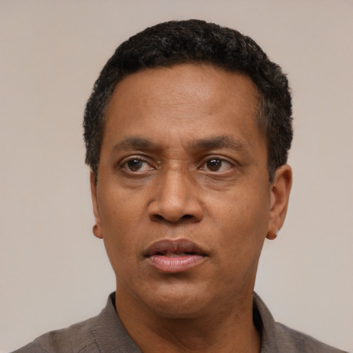 Neutral latino adult male with short  black hair and brown eyes