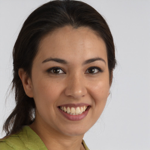 Joyful white young-adult female with medium  brown hair and brown eyes