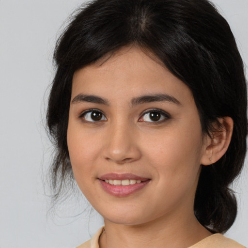 Joyful asian young-adult female with medium  brown hair and brown eyes