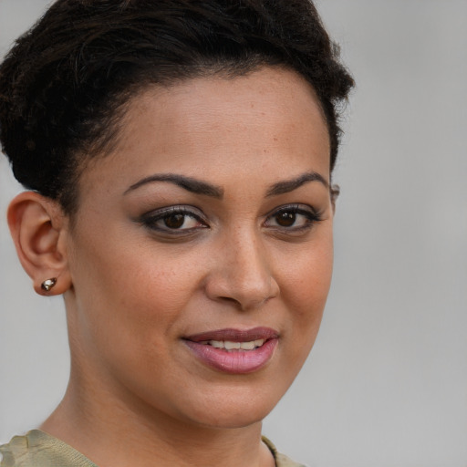 Joyful white young-adult female with short  brown hair and brown eyes