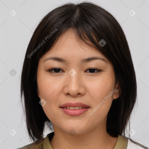 Joyful asian young-adult female with medium  brown hair and brown eyes