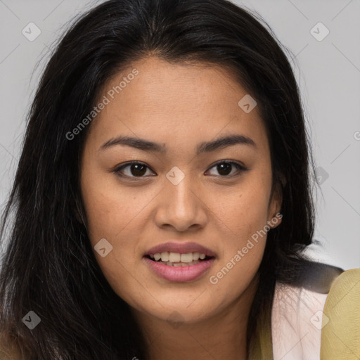 Joyful asian young-adult female with long  brown hair and brown eyes