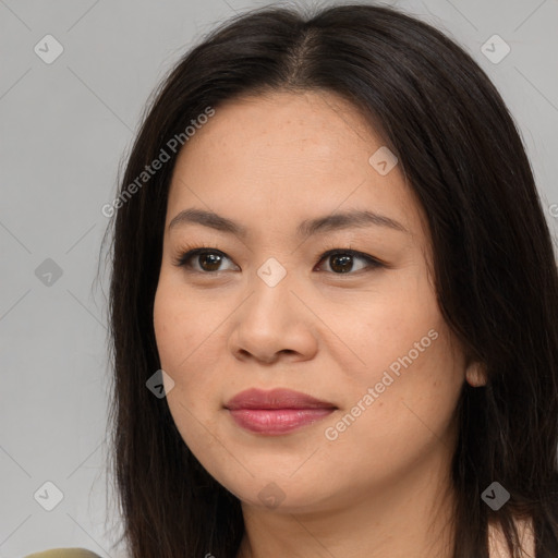 Joyful asian young-adult female with long  brown hair and brown eyes