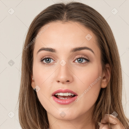 Joyful white young-adult female with long  brown hair and grey eyes