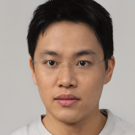 Neutral asian young-adult male with short  black hair and brown eyes