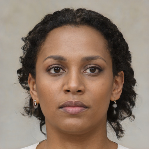 Neutral black young-adult female with medium  black hair and brown eyes
