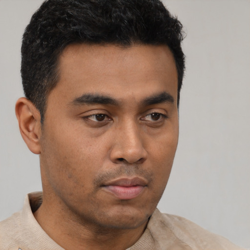 Neutral latino young-adult male with short  brown hair and brown eyes