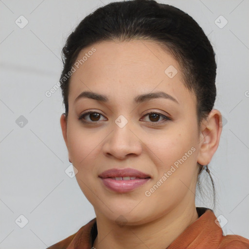 Joyful latino young-adult female with short  brown hair and brown eyes