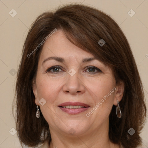 Joyful white adult female with medium  brown hair and grey eyes