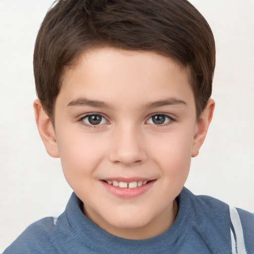 Joyful white child male with short  brown hair and brown eyes