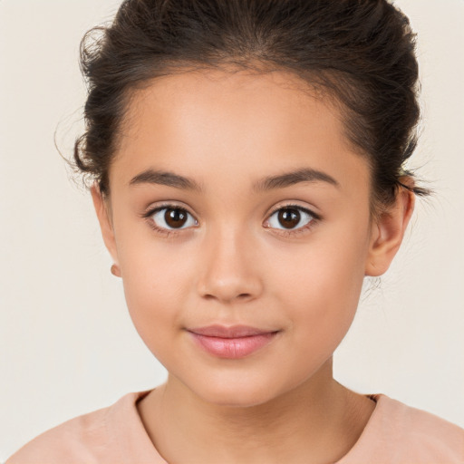 Joyful white child female with short  brown hair and brown eyes