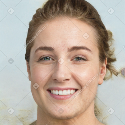 Joyful white young-adult female with short  brown hair and green eyes