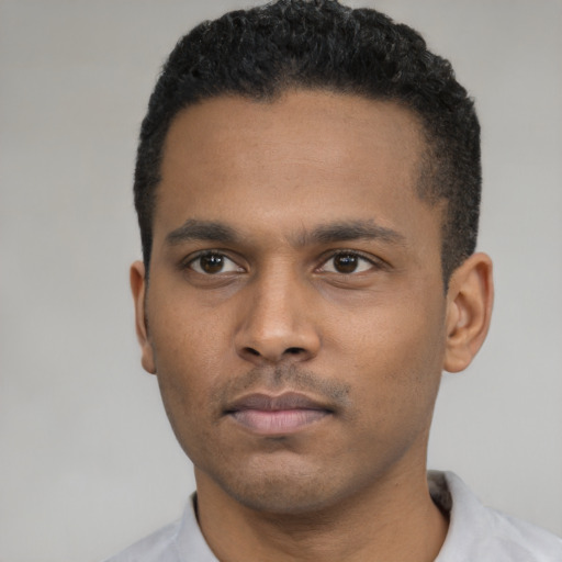 Neutral latino young-adult male with short  black hair and brown eyes