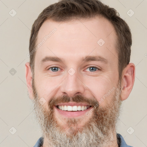 Joyful white adult male with short  brown hair and grey eyes