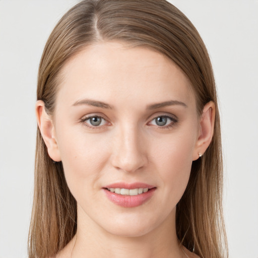 Joyful white young-adult female with long  brown hair and grey eyes